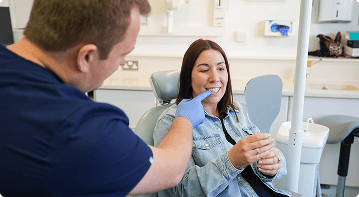 Dr Sean Roberts discussing composite bonding and tooth shape with a patient